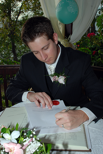 Derek Signing the Marriage Certificate